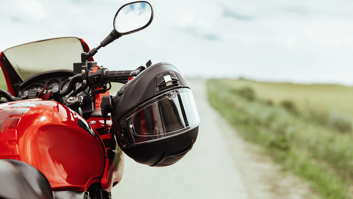 A red motorcycle on a road.