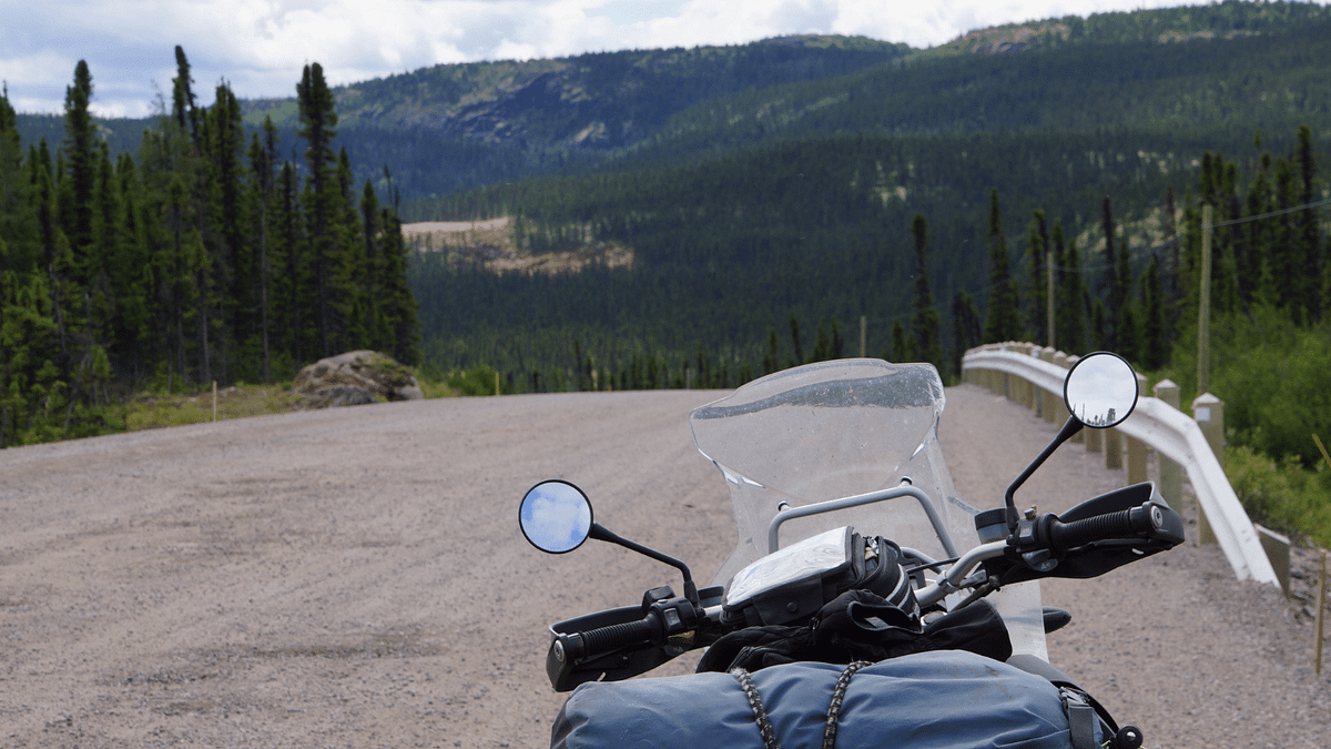 A motorcycle driving down a road.