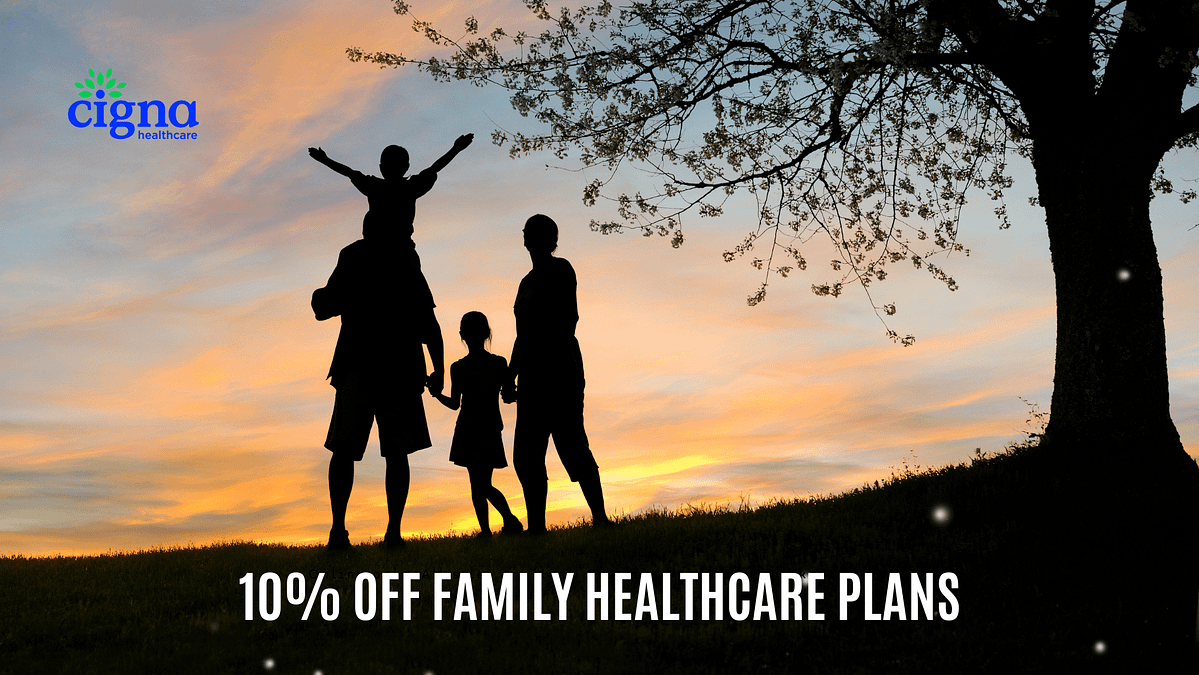 silhouette of a family under a tree with a cigna expat health insurance message