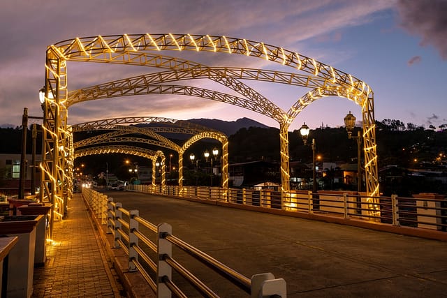 Dusk At Bridge Across The Caldera River Running Through The