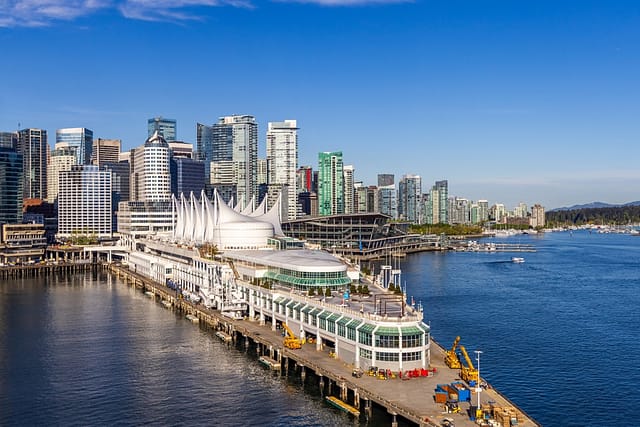 Downtown Vancouver Bc Canada Featuring Waterfront Buildings Under A Bright