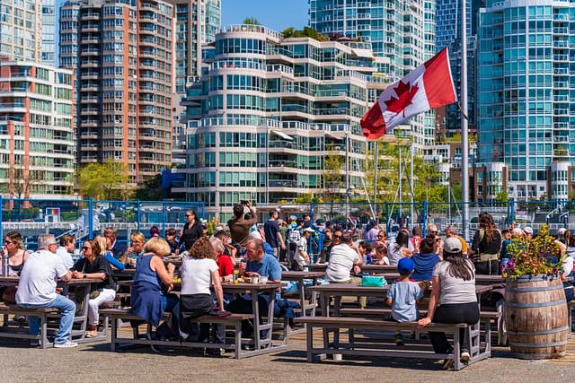 Vancouver Canada - May 01 2025: People Eating Food At