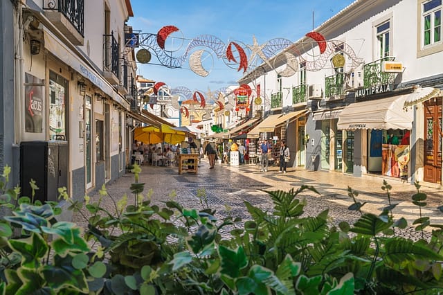 Lagos Portugal November 8 2025. Festive Lights And Yellow Umbrellas